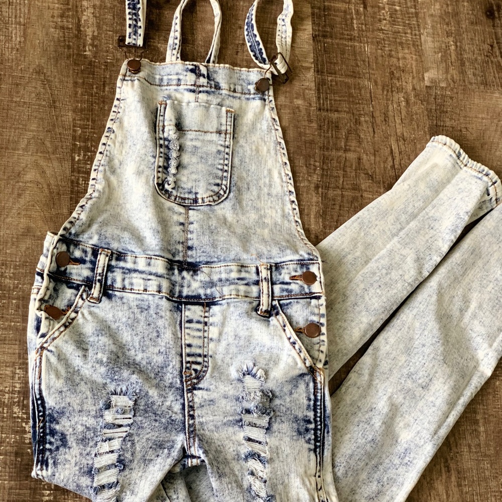 A pair of distressed denim Overalls!